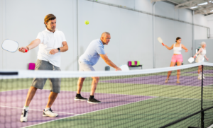 People playing pickleball indoors